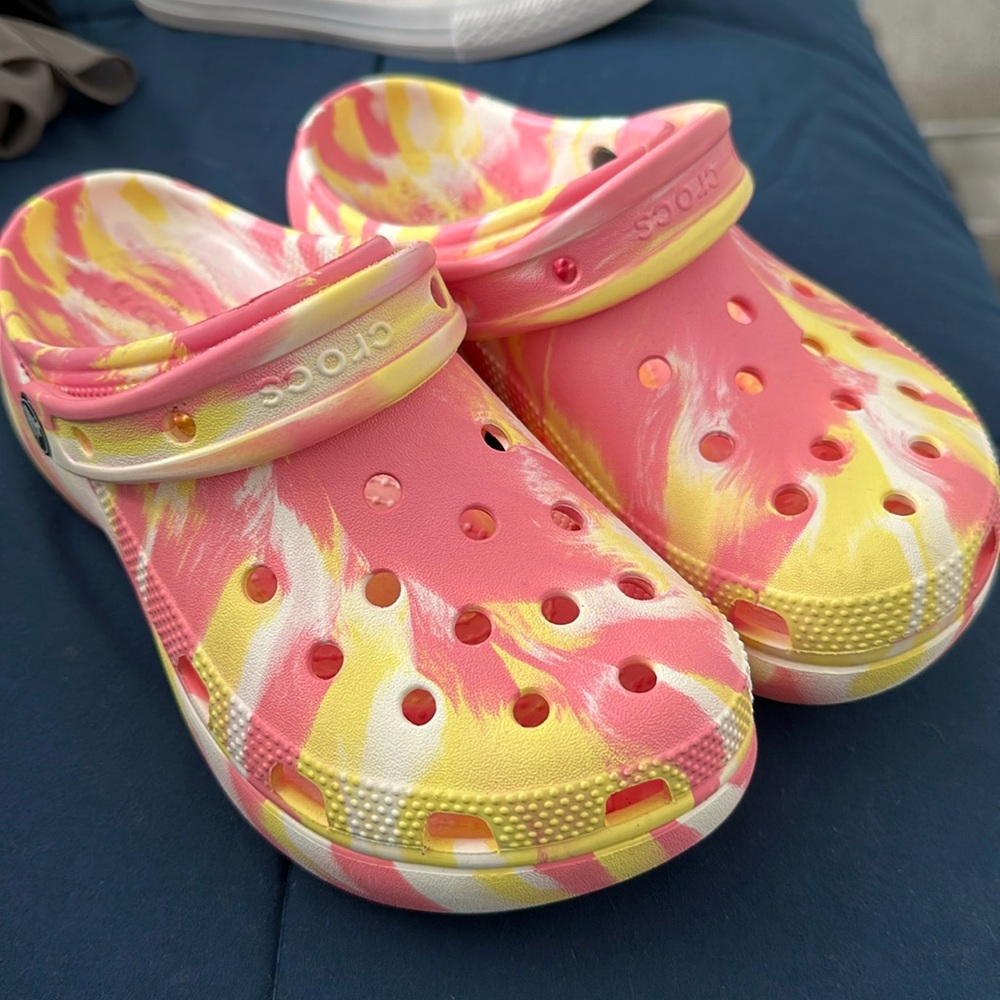 Iconic crocs. Pink, yellow and white.